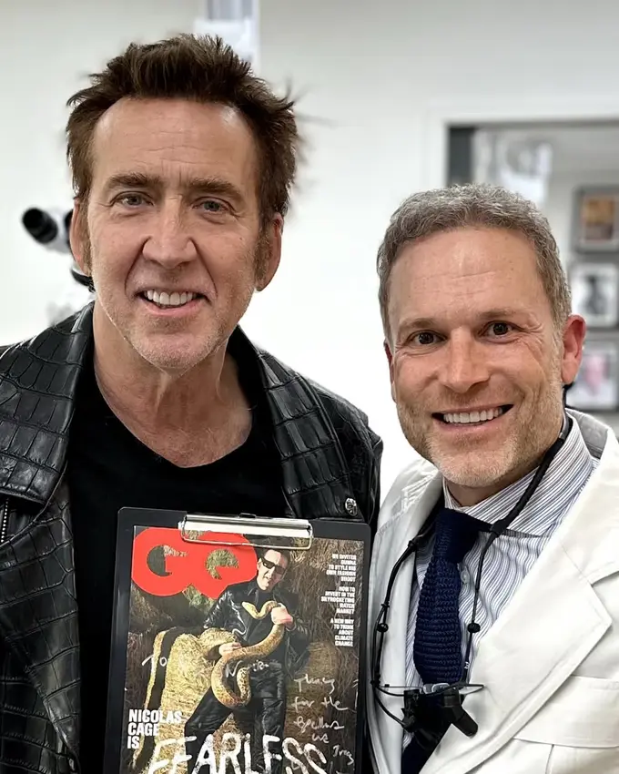 Cosmetic dentist Dr. Jon Marashi smiling with a longtime patient at his Los Angeles office