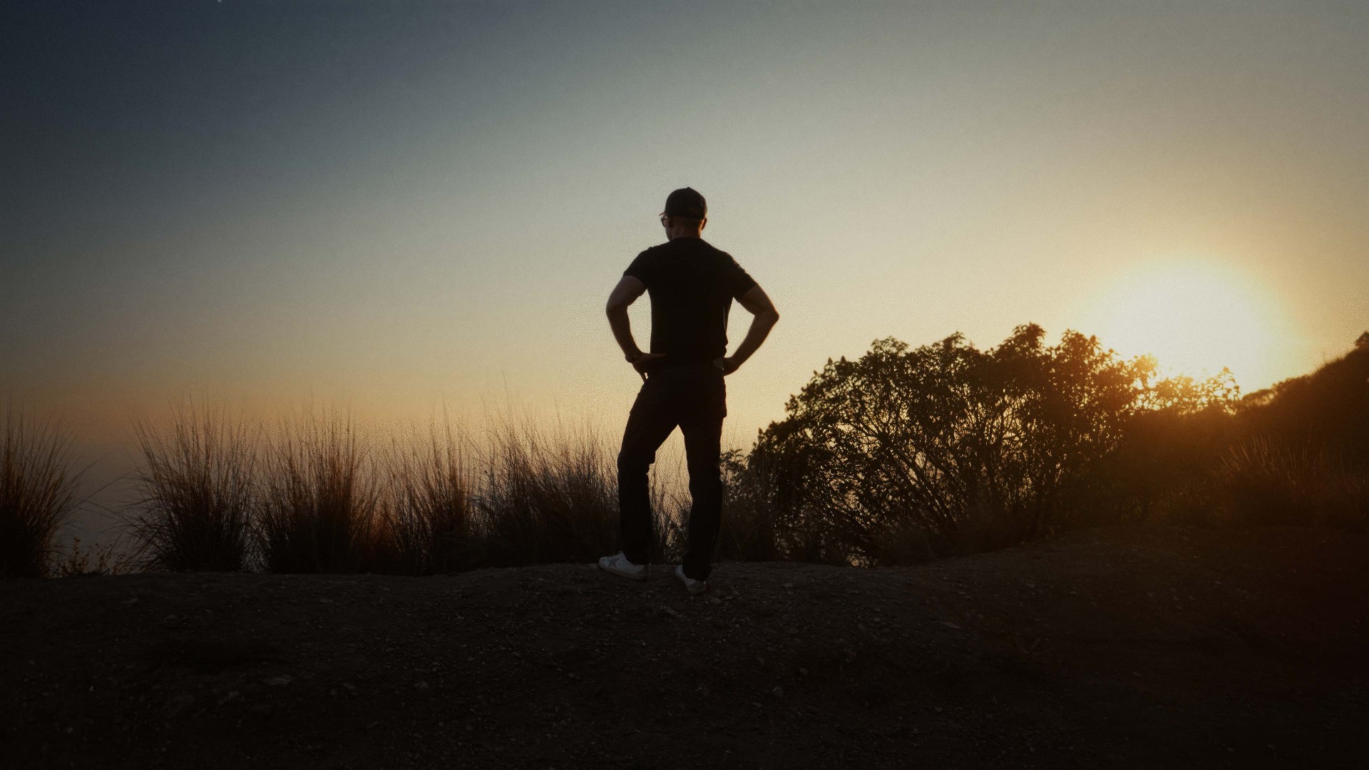 Silhouette at sunset overlooking the horizon